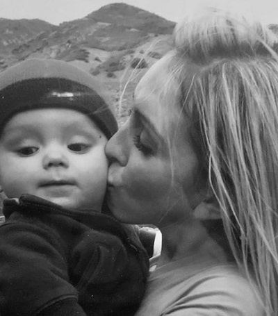 Amanda Shea kissing her baby boy Jett Shea