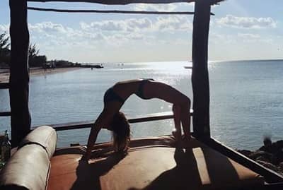 Glory Norman performing yoga