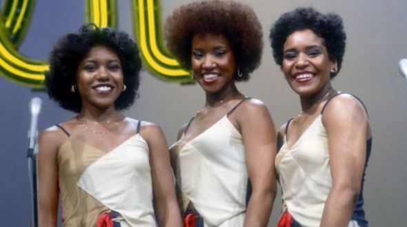 Pamela Hutchinson captured with her sisters Sheila Hutchinson and Wanda Hutchinson while performing on stage.