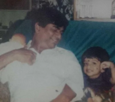 Sneha Britto as a toddler with her father Xavier Britto