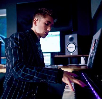 Myles Erlick playing piano