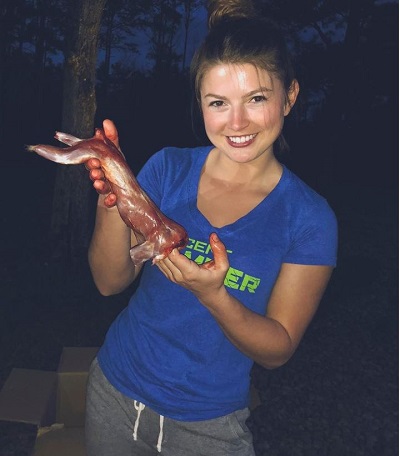 Hannah Barron showing squirrel meat