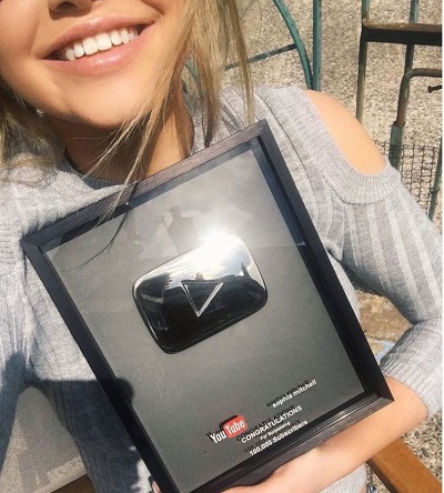 Sophia Mitchell with her silver play button