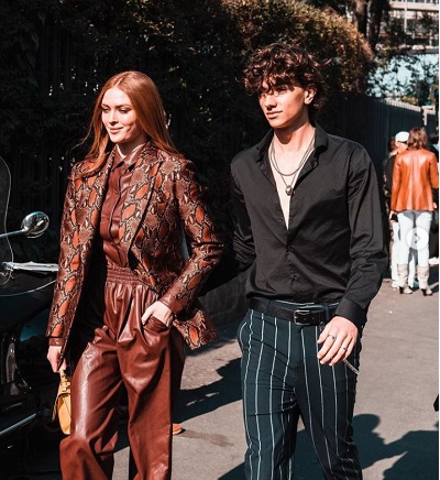 Gavin Casalegno while walking for Milan with his partner