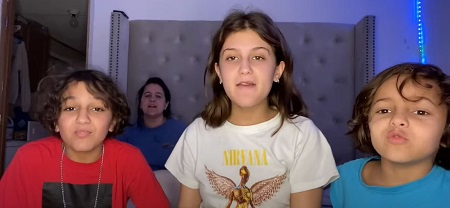 Jenny Popach along with her two brothers
