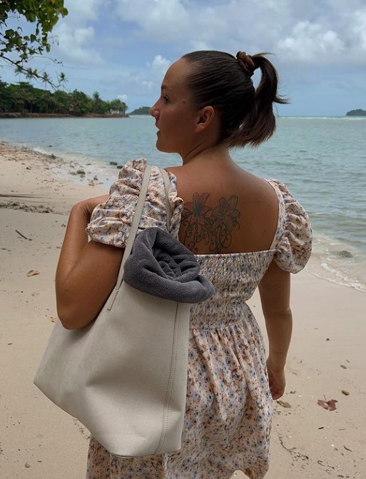 Camilla Lorentzen has a flower tattoo on her back