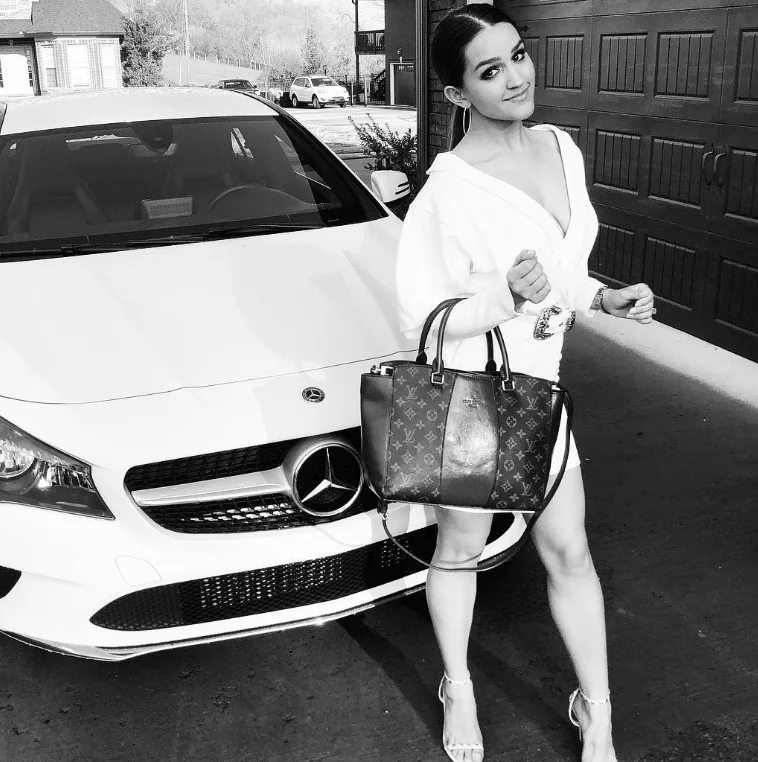 Stephanie Nicole Clark with her Mercedes car