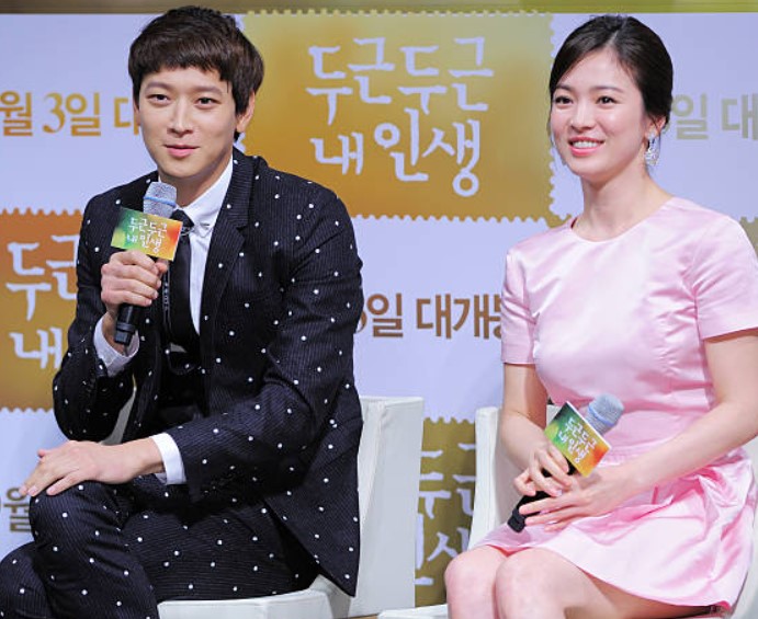Kang Dong Won with Song Hye-Kyo during a Press conference about the movie named 'My Brilliant Life'