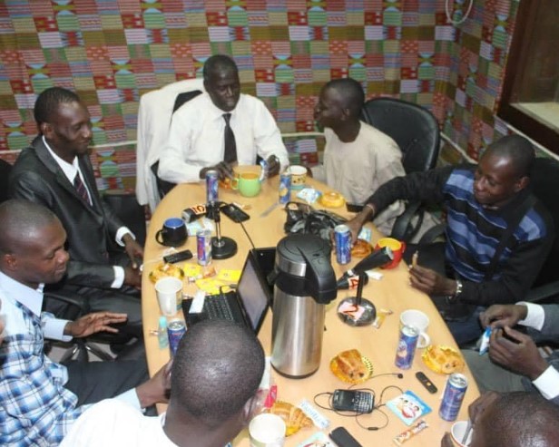 Mame Less Camara with his team members