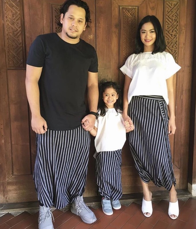 Ajeng Kartika with her husband and daughter