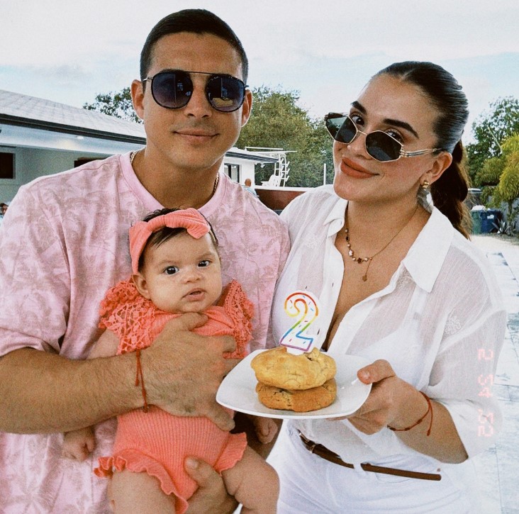Dennhi Luque with her husband and daughter