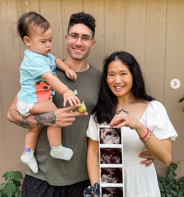 Max Lowenstein with his wife and kid