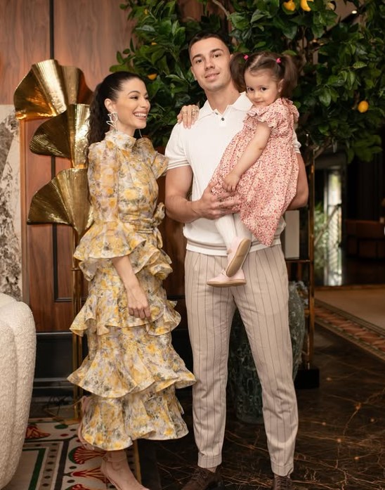 Tijana Stoisavljevic with her husband and daughter