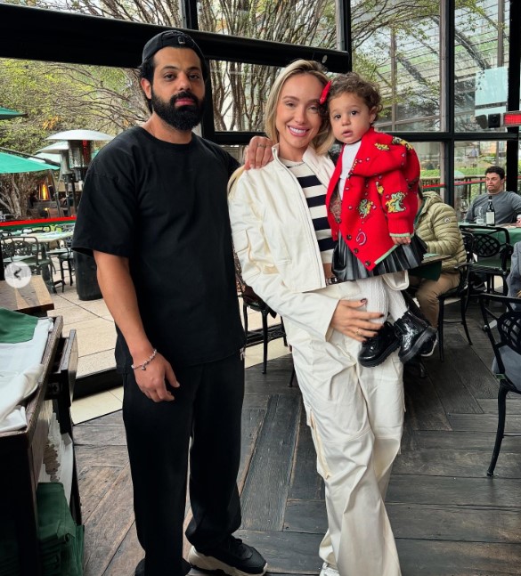 Monick Camargo with her husband and daughter