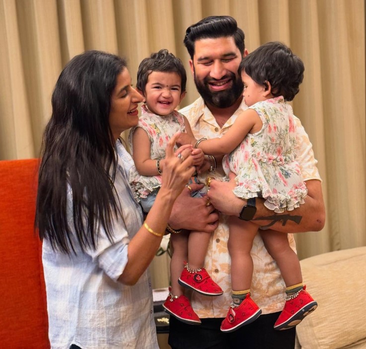 Poonam Dubey with her husband and daughters
