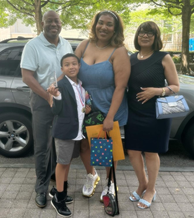 Talia Oliver with her parents and son