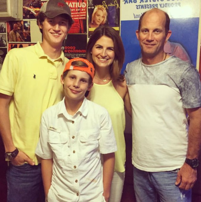 Kaitlan Collins with her dad and brothers