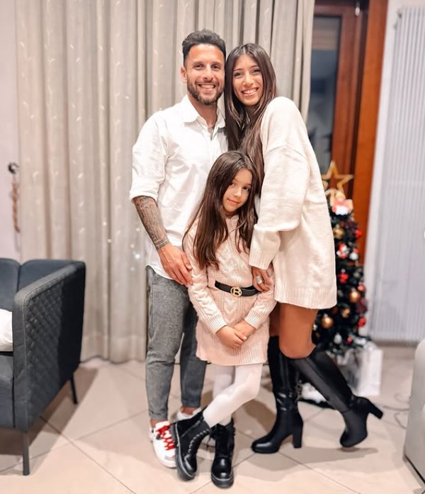 Luz Ereros with her husband and daughter