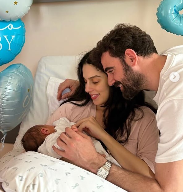 Nikos Polyderopoulos with his partner and kid