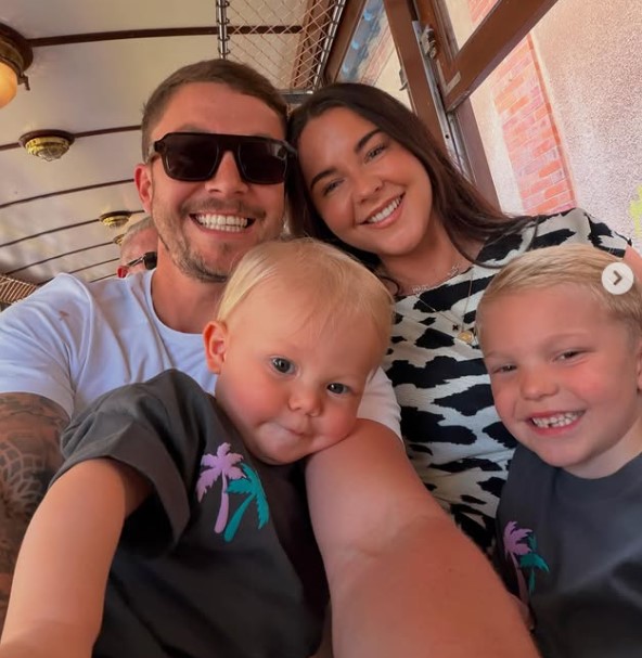 Sam Mucklow with his wife and kids
