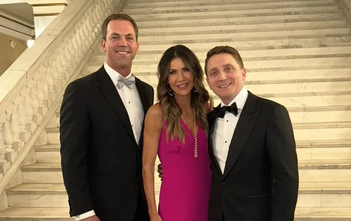 Benjamin Yoho (right) poses with Gov. Kristi Noem and Bryon Noem in the South Dakota Capitol