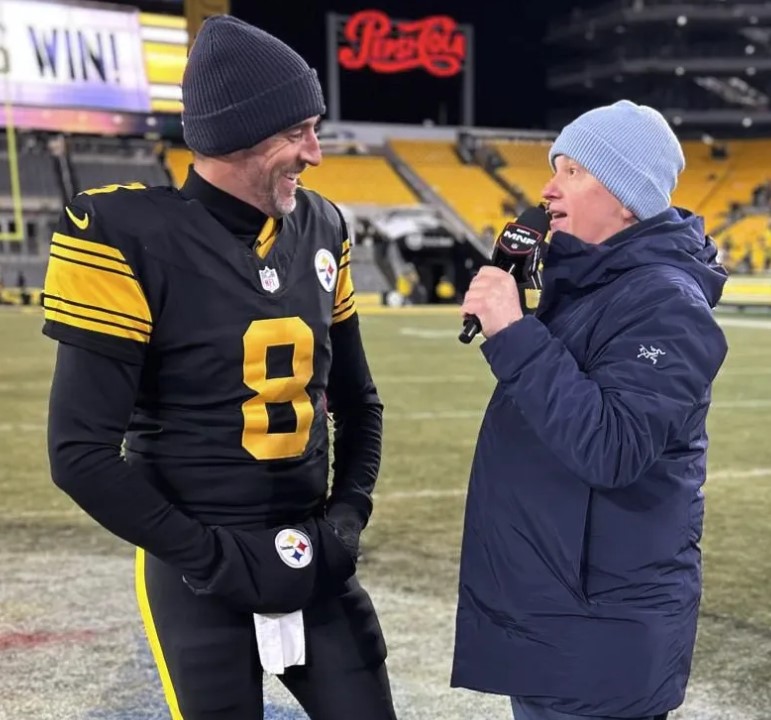 John Sutcliffe during an interview with Aaron Rodgers