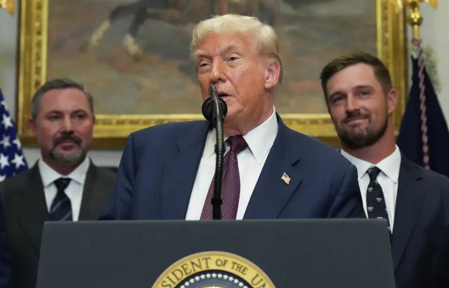 Cody Campbell with President Donald Trump and professional golfer Bryson DeChambeau during an event for the signing of an executive order restarting the Presidential Fitness Test in public schools