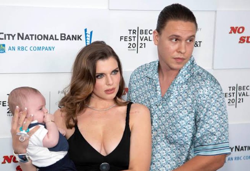 Peter Artemiev and Julia Fox with their son